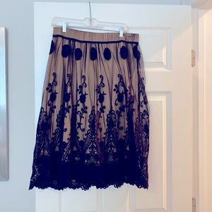 Gorgeous skirt in lace overlay in black and nude.